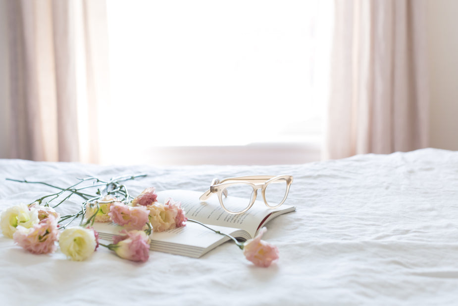 Glasses resting on a book for legal review and document work