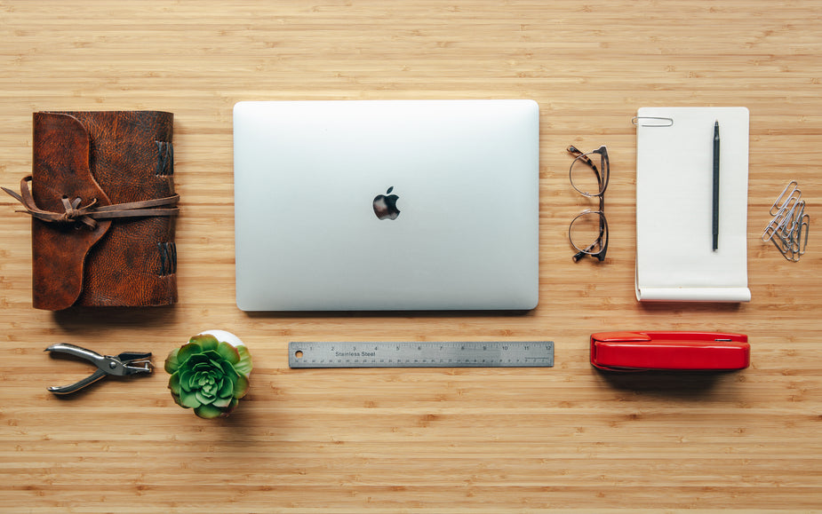Wooden desk workspace for website AI consultant deployment planning