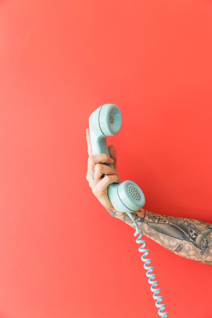 Phone handset representing customer support and live chat choices